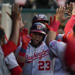 
              Washington Nationals designated hitter Nelson Cruz (23) high-fives teammates in the dugout after hitting a home run during the fifth inning of a baseball game against the Los Angeles Angels in Anaheim, Calif., Saturday, May 7, 2022. Josh Bell also scored. (AP Photo/Ashley Landis)
            