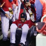 
              Boston Red Sox designated hitter J.D. Martinez rides in a laundry cart while celebrating with teammates after his two-run home run against the Houston Astros during the third inning of a baseball game at Fenway Park, Tuesday, May 17, 2022, in Boston. (AP Photo/Charles Krupa)
            