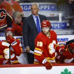 
              Calgary Flames coach Darryl Sutter watches play during the second period of Game 1 of an NHL hockey second-round playoff series against the Edmonton Oilers on Wednesday, May 18, 2022, in Calgary, Alberta. (Jeff McIntosh/The Canadian Press via AP)
            