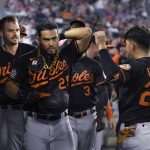 
              Baltimore Orioles' Anthony Santander, left foreground, is congratulated by Ramon Urias (29) after Santander hit a home run off Detroit Tigers relief pitcher Jacob Barnes during the eighth inning of a baseball game Friday, May 13, 2022, in Detroit. (AP Photo/Jose Juarez)
            