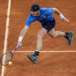 
              Andy Murray, of Britain, returns the ball against Dominic Thiem of Austria during their match at the Mutua Madrid Open tennis tournament in Madrid, Spain, Monday, May 2, 2022. (AP Photo/Manu Fernandez)
            