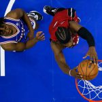 
              Miami Heat's Jimmy Butler, right, dunks against Philadelphia 76ers' Tyrese Maxey during the second half of Game 6 of an NBA basketball second-round playoff series, Thursday, May 12, 2022, in Philadelphia. (AP Photo/Matt Slocum)
            
