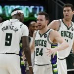 
              Milwaukee Bucks' Pat Connaughton and Bobby Portis celebrate after Game 3 against the Boston Celtics in an NBA basketball Eastern Conference semifinals playoff series Saturday, May 7, 2022, in Milwaukee. The Bucks won 103-101 to take a 2-1 lead in the series. (AP Photo/Morry Gash)
            