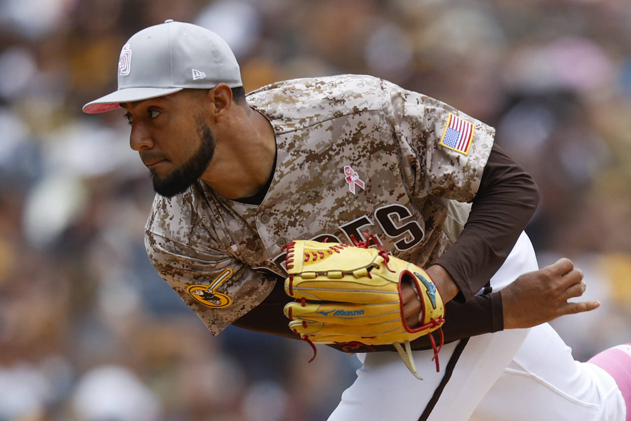 San Diego Padres' Robert Suarez pitches against the Miami Marlins during the eighth inning of a bas...