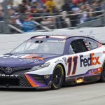 
              Denny Hamlin (11) races into Turn 1 at the NASCAR Cup Series auto race at Dover Motor Speedway, Sunday, May 1, 2022, in Dover, Del. (AP Photo/Jason Minto)
            