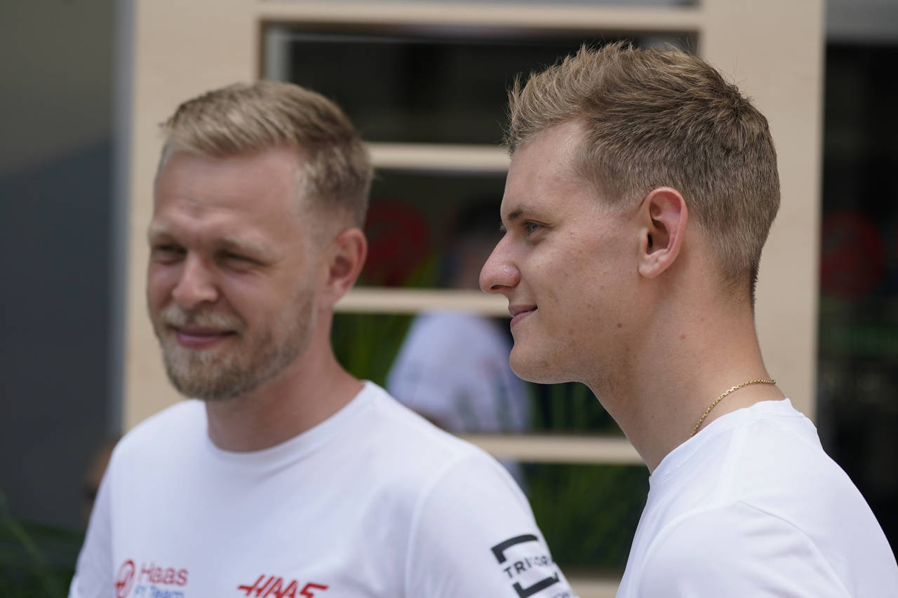 Haas driver Kevin Magnussen, left, of Denmark, stands with Haas driver Mick Schumacher, of Germany,...