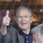 
              Former President George W. Bush gives a thumbs-up before a baseball game between the Atlanta Braves and the Texas Rangers in Arlington, Texas, Sunday, May 1, 2022. (AP Photo/LM Otero)
            