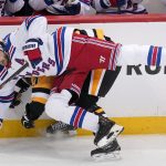 
              New York Rangers' Jacob Trouba (8) collides with Pittsburgh Penguins' Sidney Crosby during the first period in Game 3 of an NHL hockey Stanley Cup first-round playoff series in Pittsburgh, Saturday, May 7, 2022. (AP Photo/Gene J. Puskar)
            