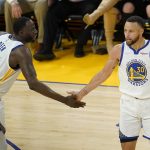 
              Golden State Warriors guard Stephen Curry (30) is congratulated by forward Draymond Green (23) after scoring against the Dallas Mavericks during the first half of Game 2 of the NBA basketball playoffs Western Conference finals in San Francisco, Friday, May 20, 2022. (AP Photo/Jeff Chiu)
            