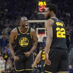 
              Golden State Warriors forward Draymond Green (23) celebrates after forward Andrew Wiggins (22) scored against the Memphis Grizzlies during the first half of Game 3 of an NBA basketball Western Conference playoff semifinal in San Francisco, Saturday, May 7, 2022. (AP Photo/Jeff Chiu)
            