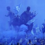 
              Fans use smoke flares as they gather for the Premier League soccer match between Everton and Chelsea outside the Goodison Park in Liverpool, England, Sunday, May 1, 2022. (AP Photo/Jon Super)
            