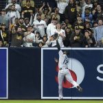 
              Miami Marlins left fielder Jorge Soler makes the catch at the wall for the out on San Diego Padres' Ha-Seong Kim during the fifth inning of a baseball game Thursday, May 5, 2022, in San Diego. (AP Photo/Gregory Bull)
            