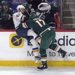 
              Minnesota Wild's Marcus Foligno (17) checks St. Louis Blues' Calle Rosen (43) in the first period of Game 5 of an NHL hockey Stanley Cup first-round playoff series, Tuesday, May 10, 2022, in St. Paul, Minn. (AP Photo/Jim Mone)
            