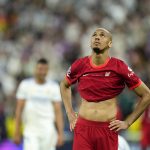 
              Liverpool's Fabinho reacts at the end of the Champions League final soccer match between Liverpool and Real Madrid at the Stade de France in Saint Denis near Paris, Saturday, May 28, 2022. Real Madrid defeated Liverpool 1-0. (AP Photo/Manu Fernandez)
            