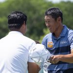 
              James Hahn, right, shakes hands with Joohyung Kim, left, of South Korea, after completing the third round of the AT&T Byron Nelson golf tournament in McKinney, Texas, on Saturday, May 14, 2022. (AP Photo/Emil Lippe)
            