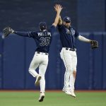
              Tampa Bay Rays right fielder Brett Phillips (35) and center fielder Kevin Kiermaier celebrate after the team defeated the Miami Marlins during a baseball game Tuesday, May 24, 2022, in St. Petersburg, Fla. (AP Photo/Chris O'Meara)
            
