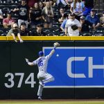 
              Kansas City Royals left fielder Andrew Benintendi is unable to make a play on a double by Arizona Diamondbacks' Daulton Varsho during the sixth inning of a baseball game Tuesday, May 24, 2022, in Phoenix. (AP Photo/Ross D. Franklin)
            