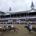 
              Horses run in the 148th running of the Kentucky Oaks horse race at Churchill Downs Friday, May 6, 2022, in Louisville, Ky. (AP Photo/Jeff Roberson)
            