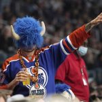 
              An Edmonton Oilers fan gestures during the third period in Game 3 of an NHL hockey Stanley Cup first-round playoff series against the Los Angeles Kings Friday, May 6, 2022, in Los Angeles. (AP Photo/Mark J. Terrill)
            