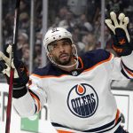 
              Edmonton Oilers left wing Evander Kane gestures after scoring an empty net goal during the third period in Game 6 of an NHL hockey Stanley Cup first-round playoff series against the Los Angeles Kings Thursday, May 12, 2022, in Los Angeles. (AP Photo/Mark J. Terrill)
            