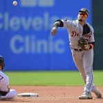 
              Detroit Tigers shortstop Javier Baez gets Cleveland Guardians' Andres Gimenez out at second base in the seventh inning of a baseball game, Sunday, May 22, 2022, in Cleveland. Steven Kwan would be out at first. The Tigers won 4-2. (AP Photo/David Dermer)
            