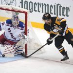 
              Pittsburgh Penguins' Kris Letang (58) can't get a shot past New York Rangers goaltender Igor Shesterkin during the first period in Game 4 of an NHL hockey Stanley Cup first-round playoff series in Pittsburgh, Monday, May 9, 2022. (AP Photo/Gene J. Puskar)
            