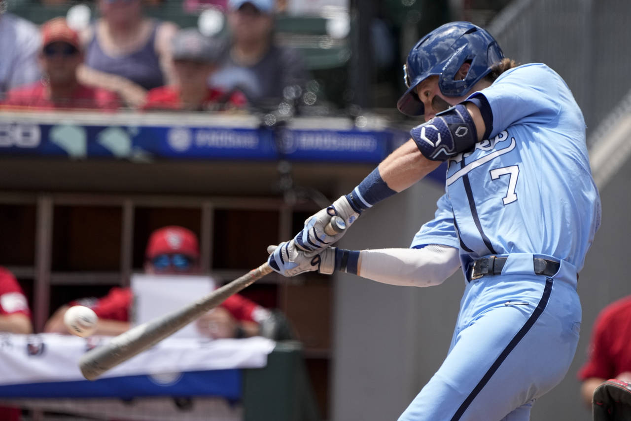 North Carolina's Vance Honeycutt hits a two-run home run against NC State during the first inning i...