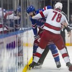 
              New York Rangers defenseman Jacob Trouba (8) and Carolina Hurricanes center Steven Lorentz (78) fight in the first period of Game 4 of an NHL hockey Stanley Cup second-round playoff series, Tuesday, May 24, 2022, in New York. (AP Photo/John Minchillo)
            