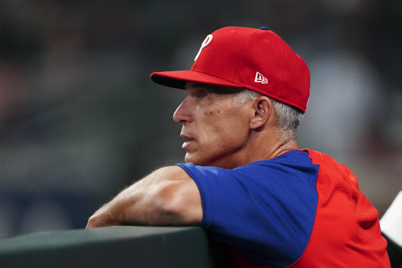 Philadelphia Phillies manager Joe Girardi looks on from the dugout during the seventh inning of a b...