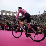 
              Australia's Jai Hindley wearing the pink jersey, the overall leader, enters the Arena at the end of the 21st stage against the clock race of the Giro D'Italia, in Verona, Italy, Sunday, May 29, 2022. (Fabio Ferrari/LaPresse via AP)
            