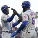 
              New York Mets' Francisco Lindor, left, celebrates with Starling Marte after both scored on a three-run home run hit by Pete Alonso during the third inning of a baseball game against the San Francisco Giants in San Francisco, Monday, May 23, 2022. (AP Photo/Jeff Chiu)
            