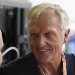 
              Professional golfer Greg Norman walks through the pit area during the third practice session for the Formula One Miami Grand Prix auto race at the Miami International Autodrome, Saturday, May 7, 2022, in Miami Gardens, Fla. (AP Photo/Darron Cummings)
            