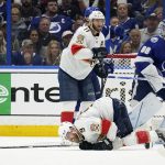 
              Florida Panthers center Sam Bennett (9) goes down after blocking a shot in front of Tampa Bay Lightning goaltender Andrei Vasilevskiy (88) during the second period in Game 4 of an NHL hockey second-round playoff series Monday, May 23, 2022, in Tampa, Fla. (AP Photo/Chris O'Meara)
            