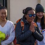 
              Nepalese climber Lhakpa Sherpa gestures as she arrives at the airport in Kathmandu, Nepal, Tuesday, May 17, 2022. The Nepali Sherpa broke her own record reaching the 8,849-meter (29,032-foot) summit for a 10th time — the most times any woman has climbed Mount Everest. Sherpa, 48, said she is next planning to scale the world's second-highest peak, K2 in Pakistan. (AP Photo/Niranjan Shrestha)
            