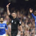 
              Referee Michael Oliver, centre, during the Premier League soccer match between Everton and Brentford at Goodison Park in Liverpool, England, Sunday, May 15, 2022. (AP Photo/Jon Super)
            