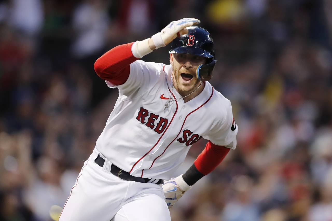 Boston Red Sox's Trevor Story looks to the dugout after hitting a grand slam against the Seattle Ma...