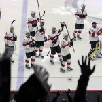 
              Switzerland's team celebrates after winning the group A Hockey World Championship match between Canada and Switzerland in Helsinki, Finland, Saturday May 21 2022. (AP Photo/Martin Meissner)
            