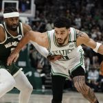 
              Boston Celtics' Jayson Tatum tries to get past Milwaukee Bucks' Wesley Matthews during the second half of Game 6 of an NBA basketball Eastern Conference semifinals playoff series Friday, May 13, 2022, in Milwaukee. The Celtics won 108-95 to tie the series at 3-3. (AP Photo/Morry Gash)
            