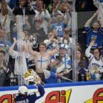
              Fans cheer after the Hockey World Championship final match between Finland and Canada, Sunday May 29, 2022, in Tampere, Finland. Finland won 4-3 in overtime. (AP Photo/Martin Meissner)
            