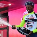 
              Eritrea's Biniam Girmay celebrates on the podium after winning the 10th stage of the Giro D'Italia cycling race from Pescara to Jesi, Italy,  Tuesday, May 17, 2022. (Massimo Paolone/LaPresse via AP)
            