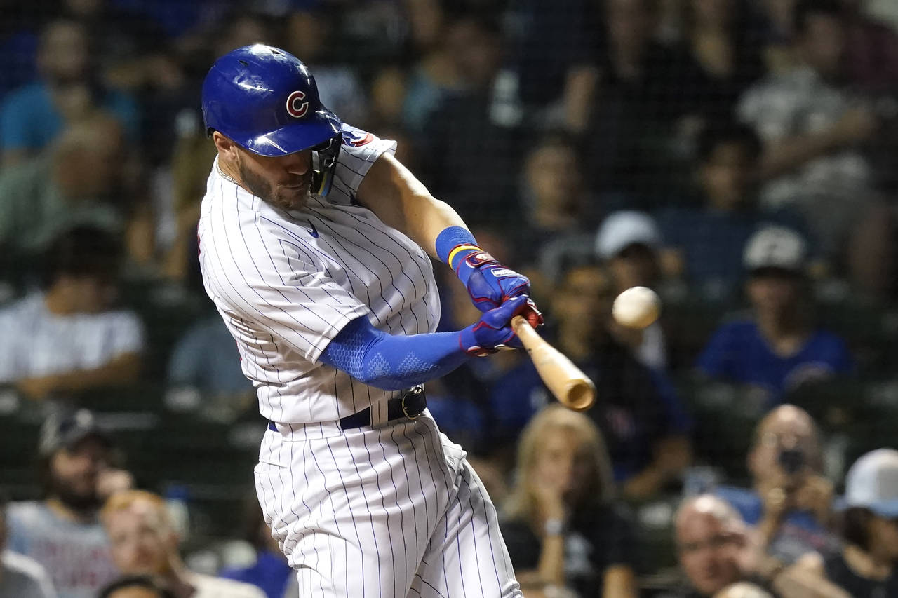 Chicago Cubs' Patrick Wisdom hits a home run off Milwaukee Brewers relief pitcher Brad Boxberger du...