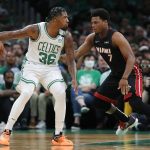 
              Boston Celtics' Marcus Smart (36) is defended by Miami Heat's Kyle Lowry (7) during the first half of Game 3 of the NBA basketball playoffs Eastern Conference finals Saturday, May 21, 2022, in Boston. (AP Photo/Michael Dwyer)
            