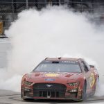 
              Joey Logano celebrates with a burnout after winning a NASCAR Cup Series auto race at Darlington Raceway, Sunday, May 8, 2022, in Darlington, S.C. (AP Photo/Matt Kelley)
            