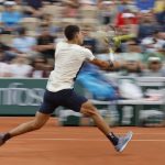 
              Spain's Carlos Alcaraz volleys the ball to Albert Ramos-Vinolas during their second round match of the French Open tennis tournament at the Roland Garros stadium Wednesday, May 25, 2022 in Paris. (AP Photo/Jean-Francois Badias)
            