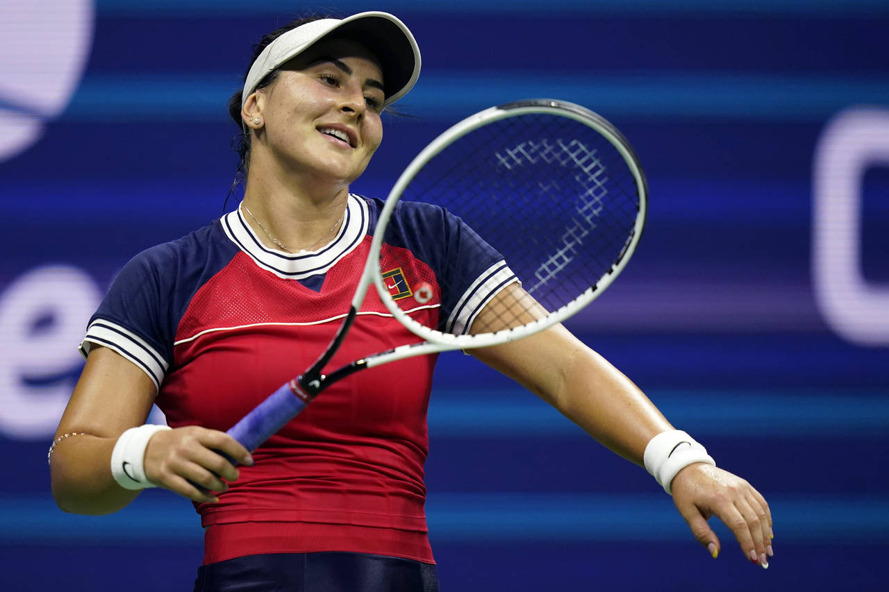 FILE - Bianca Andreescu, of Canada, reacts between points during the first round of the U.S. Open t...