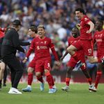 
              Liverpool players runs towards Liverpool's manager Jurgen Klopp, left, celebrating after scoring the winning penalty in a penalty shootout at the end of the English FA Cup final soccer match between Chelsea and Liverpool, at Wembley stadium, in London, Saturday, May 14, 2022. Liverpool won 6-5 on penalties after the game ended in a goalless draw. (AP Photo/Ian Walton)
            