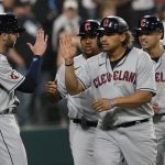 
              Cleveland Guardians' Josh Naylor, center, celebrates his game tying grand slam off Chicago White Sox relief pitcher Liam Hendriks during the ninth inning of a baseball game Monday, May 9, 2022, in Chicago. (AP Photo/Charles Rex Arbogast)
            