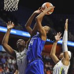 
              Dallas Wings center Teaira McCowan (7) fouls Connecticut Sun forward DeWanna Bonner (24) on a drive to the basket during the first half of a WNBA basketball game Tuesday, May 24, 2022 at Mohegan Sun Arena in Uncasville, Conn.  (Sean D. Elliot/The Day via AP)
            