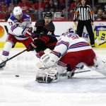 
              Carolina Hurricanes' Teuvo Teravainen (86) drives the puck around New York Rangers' Adam Fox (23) to shoot at goaltender Igor Shesterkin (31) during the second period of Game 5 of an NHL hockey Stanley Cup second-round playoff series in Raleigh, N.C., Thursday, May 26, 2022. (AP Photo/Karl B DeBlaker)
            