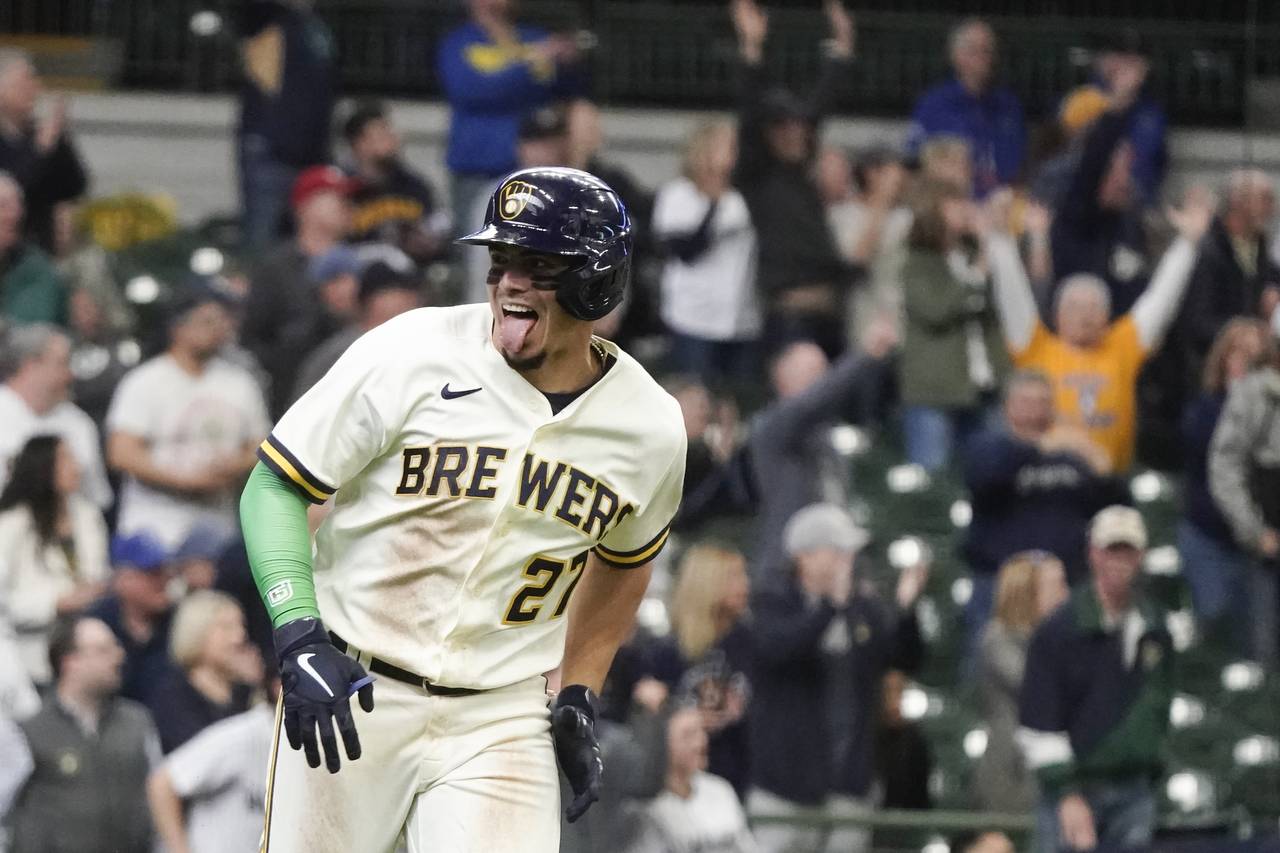 Milwaukee Brewers' Willy Adames celebrates after hitting a two-run home run during the eighth innin...